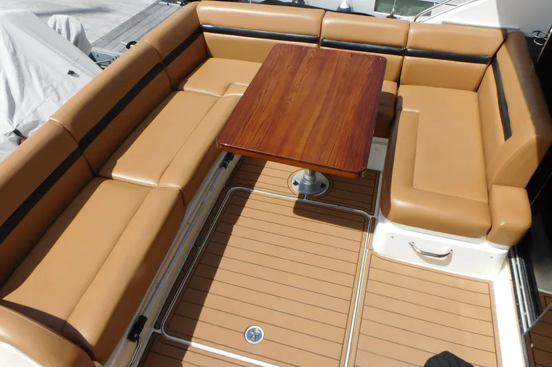 Slide: The Image of Luxurious seating area on 2013 Sea Ray 510 Sundancer yacht with wooden table. - 20