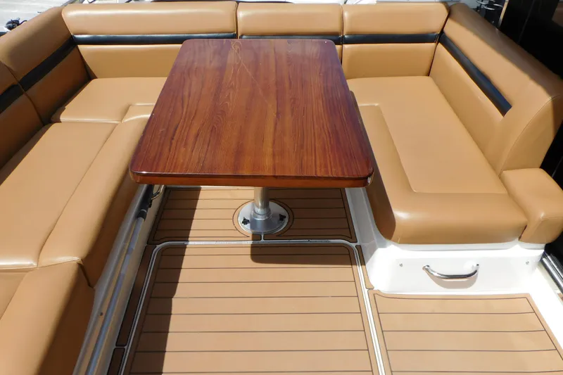 Slide: The Image of Luxurious seating area on 2013 Sea Ray 510 Sundancer yacht with wooden table. - 21