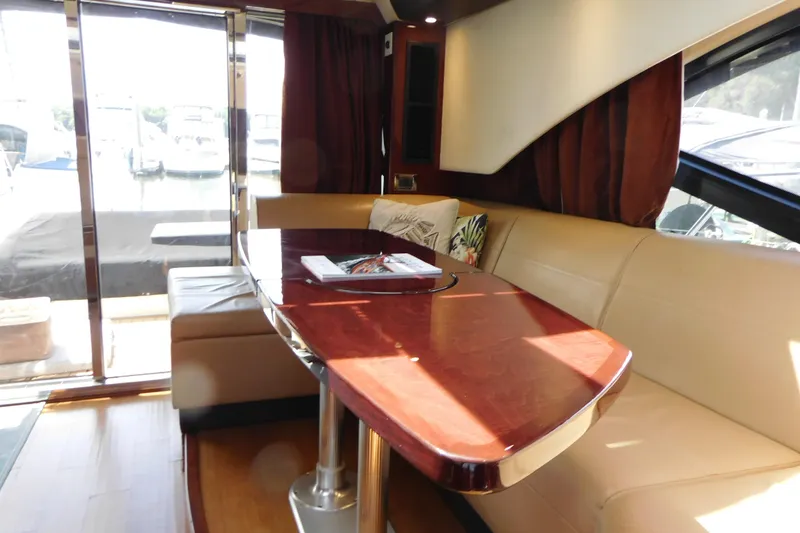 Slide: The Image of Luxurious interior of 2013 Sea Ray 510 Sundancer yacht with elegant seating and table. - 34