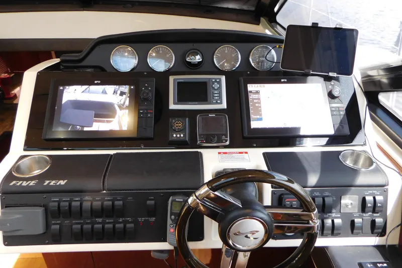 Slide: The Image of Helm of 2013 Sea Ray 510 Sundancer with advanced navigation displays and controls. - 38