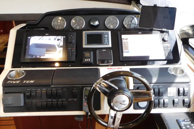 Slide: The Image of 2013 Sea Ray 510 Sundancer helm with advanced navigation displays and controls. - 39
