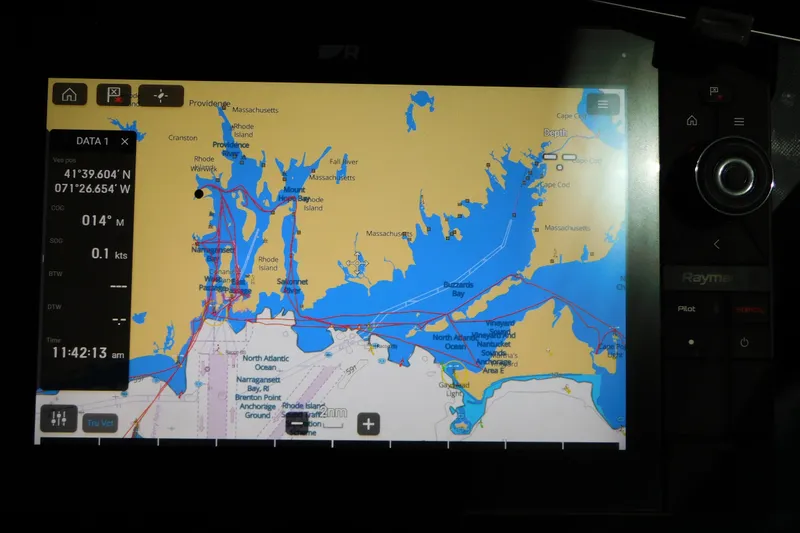 Slide: The Image of Navigation screen on a 2013 Sea Ray 510 Sundancer, showing coastal map and coordinates. - 41