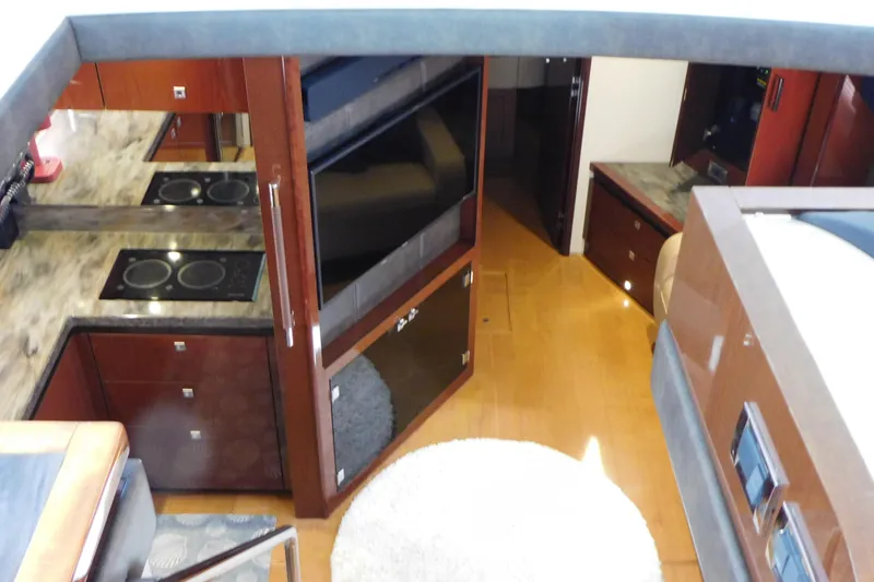 Slide: The Image of Luxurious interior of 2013 Sea Ray 510 Sundancer yacht with modern kitchen and cozy living space. - 45