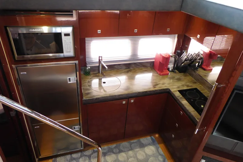 Slide: The Image of Luxurious kitchen interior of 2013 Sea Ray 510 Sundancer yacht with modern appliances. - 47