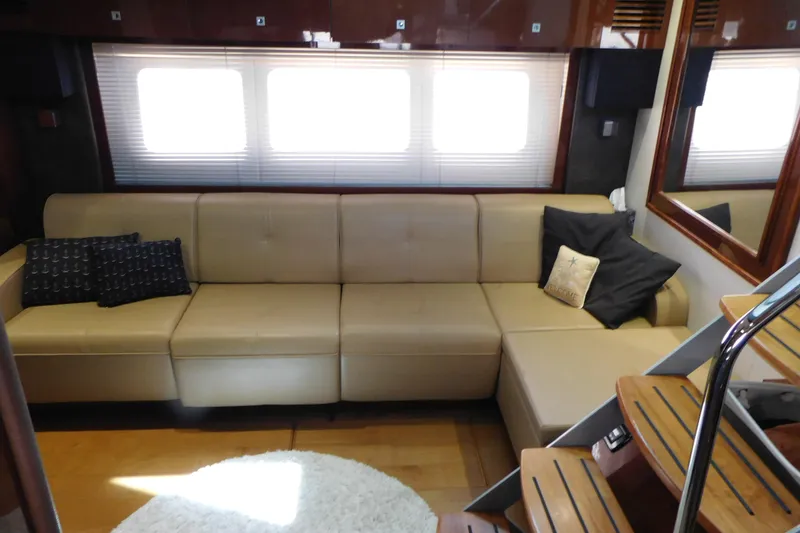 Slide: The Image of Luxurious interior of 2013 Sea Ray 510 Sundancer yacht with beige leather sofa. - 48