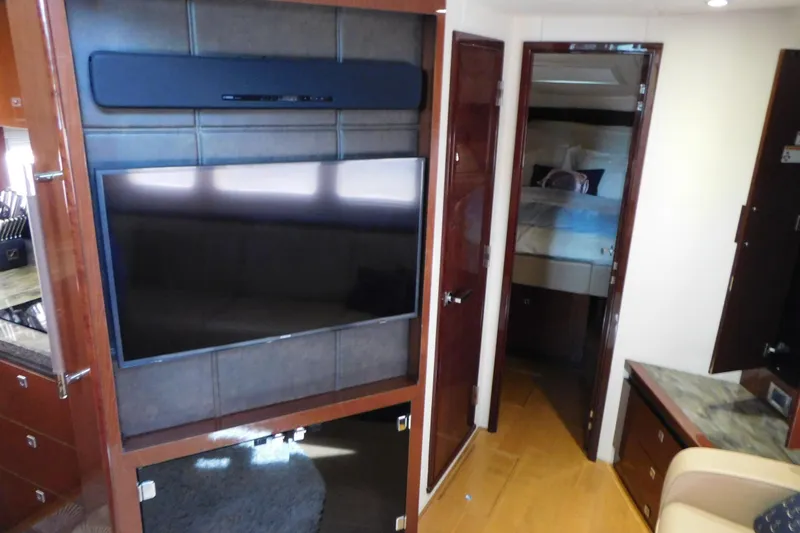 Slide: The Image of Interior of 2013 Sea Ray 510 Sundancer yacht with TV and bedroom view. - 51