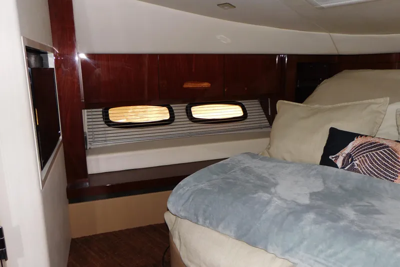 Slide: The Image of Luxurious cabin interior of 2013 Sea Ray 510 Sundancer yacht with cozy bedding. - 54