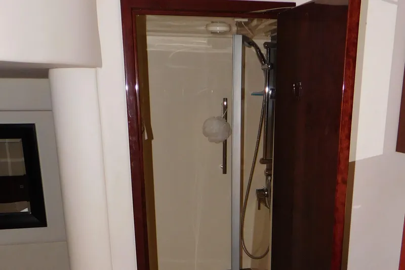 Slide: The Image of Shower area in 2013 Sea Ray 510 Sundancer yacht, featuring sleek design and modern fixtures. - 59