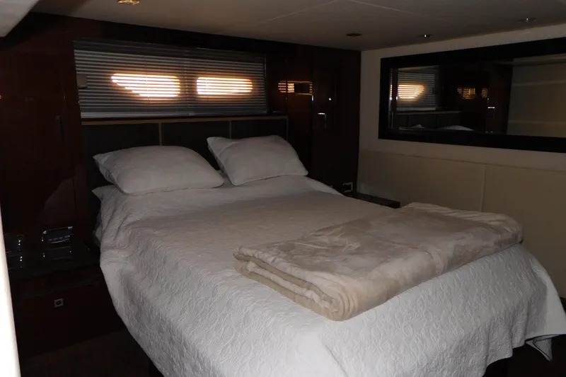 Slide: The Image of Luxurious bedroom interior of 2013 Sea Ray 510 Sundancer yacht with cozy bedding. - 60