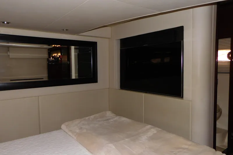 Slide: The Image of Luxurious interior of 2013 Sea Ray 510 Sundancer yacht bedroom with modern decor. - 62