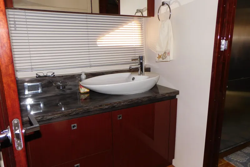 Slide: The Image of Luxurious bathroom in 2013 Sea Ray 510 Sundancer yacht with modern sink and elegant finishes. - 63