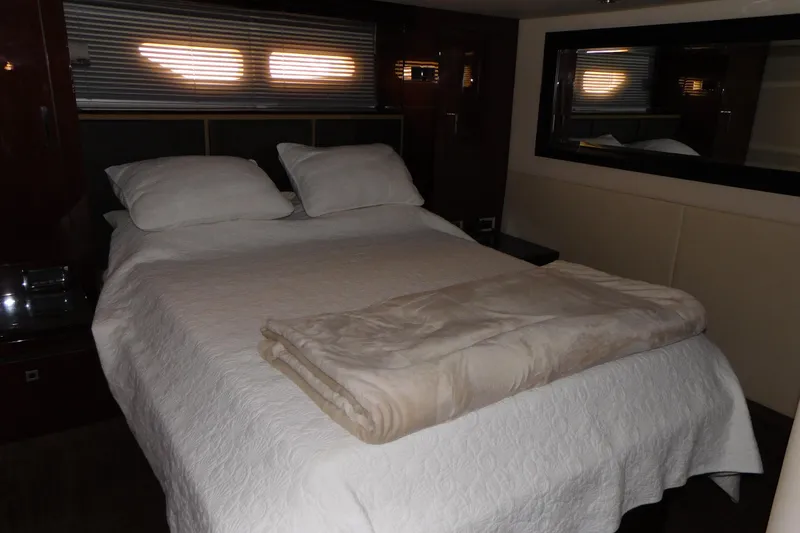 Slide: The Image of Luxurious bedroom interior of 2013 Sea Ray 510 Sundancer yacht with cozy bedding. - 64