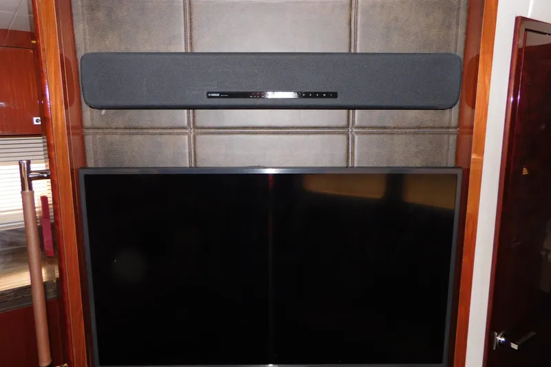 Slide: The Image of Entertainment system with soundbar and TV on 2013 Sea Ray 510 Sundancer yacht. - 66