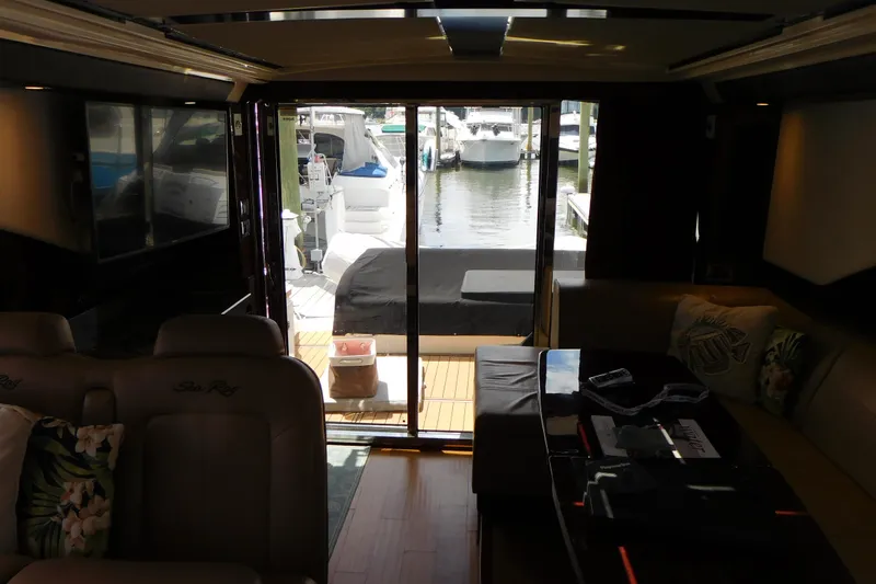 Slide: The Image of Interior view of 2013 Sea Ray 510 Sundancer yacht with marina backdrop. - 67