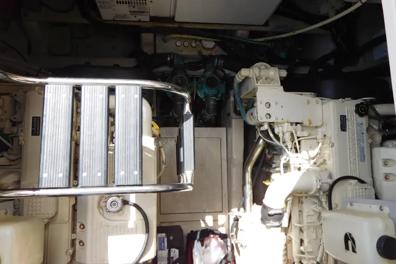 Slide: The Image of Engine room of 2013 Sea Ray 510 Sundancer with visible machinery and ladder. - 69