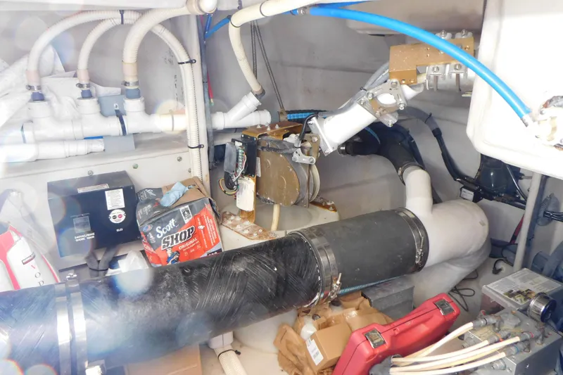 Slide: The Image of Engine room of 2013 Sea Ray 510 Sundancer with pipes, tools, and equipment. - 71