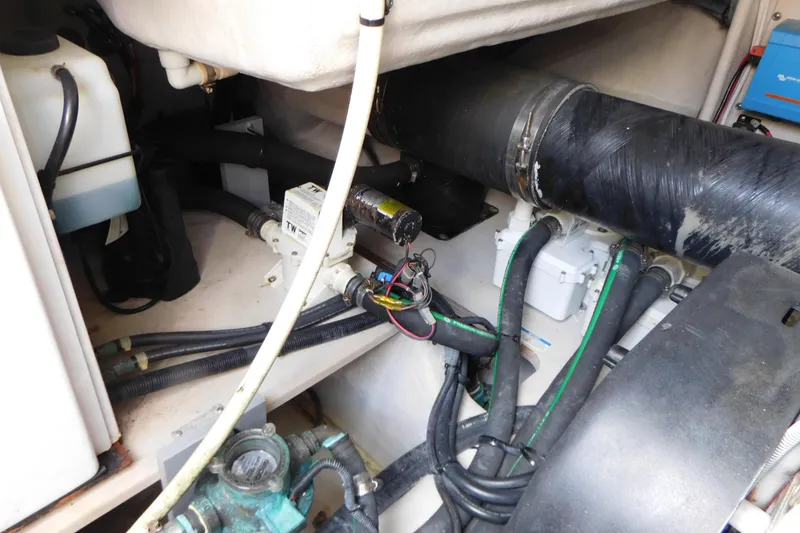 Slide: The Image of Engine compartment of 2013 Sea Ray 510 Sundancer with hoses and mechanical components. - 72