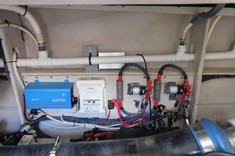 Slide: The Image of Engine room of 2013 Sea Ray 510 Sundancer with electrical components and wiring. - 73