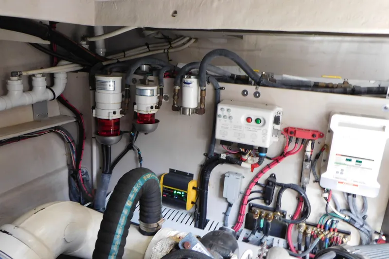 Slide: The Image of Engine room of 2013 Sea Ray 510 Sundancer with wiring and fuel filters. - 74