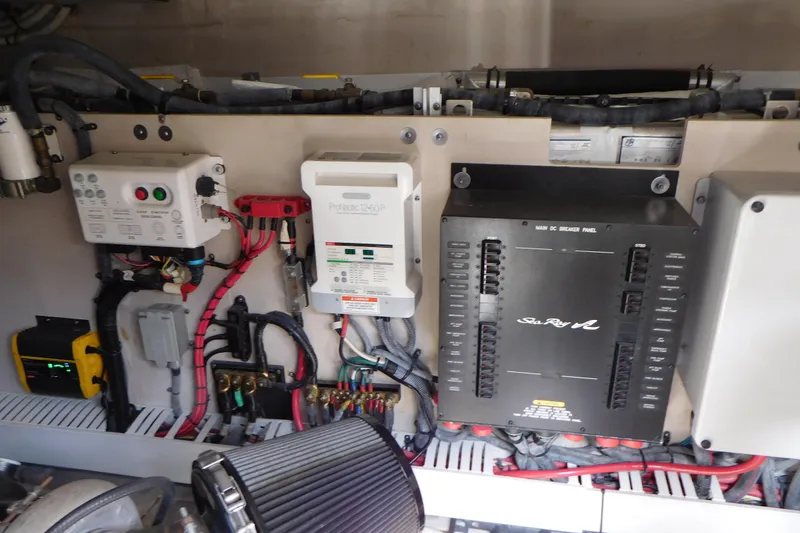 Slide: The Image of Engine room of 2013 Sea Ray 510 Sundancer, featuring electrical panels and wiring. - 75