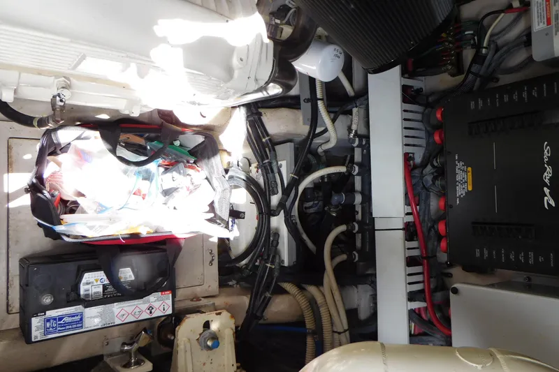 Slide: The Image of Engine room of 2013 Sea Ray 510 Sundancer with wiring and equipment. - 77