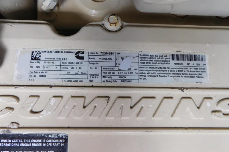 Slide: The Image of Cummins engine label on 2013 Sea Ray 510 Sundancer, detailing specifications and warnings. - 78