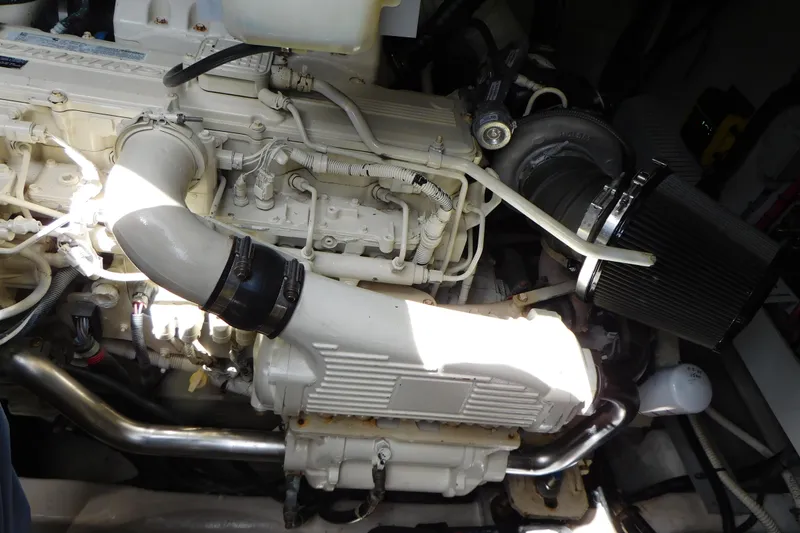 Slide: The Image of Engine compartment of a 2013 Sea Ray 510 Sundancer boat, showcasing mechanical components. - 79