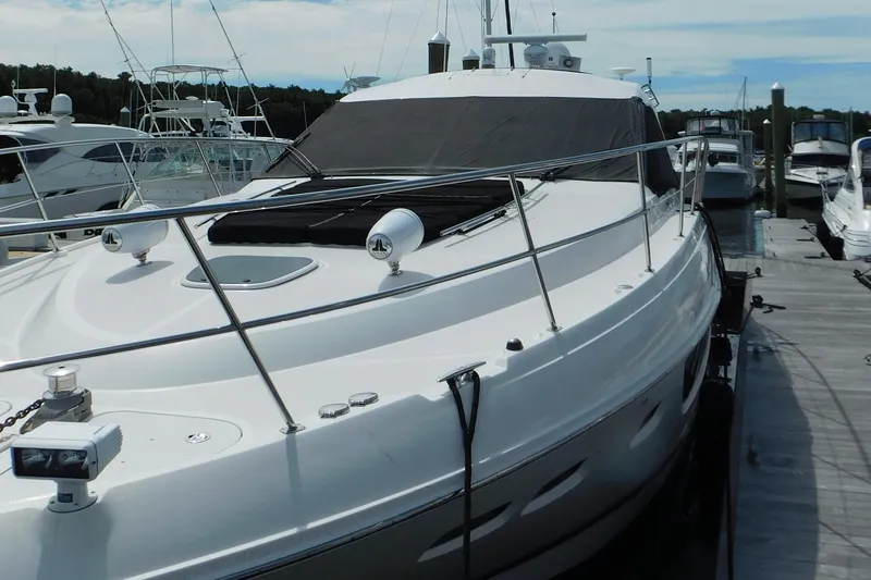 Slide: The Image of 2013 Sea Ray 510 Sundancer yacht docked at marina, featuring sleek design and modern amenities. - 8