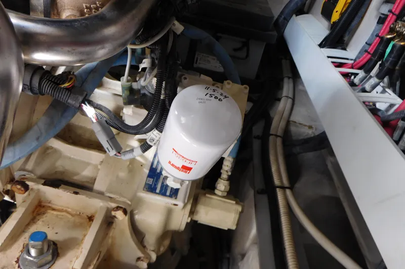 Slide: The Image of Engine compartment of a 2013 Sea Ray 510 Sundancer, featuring wiring and a filter. - 87