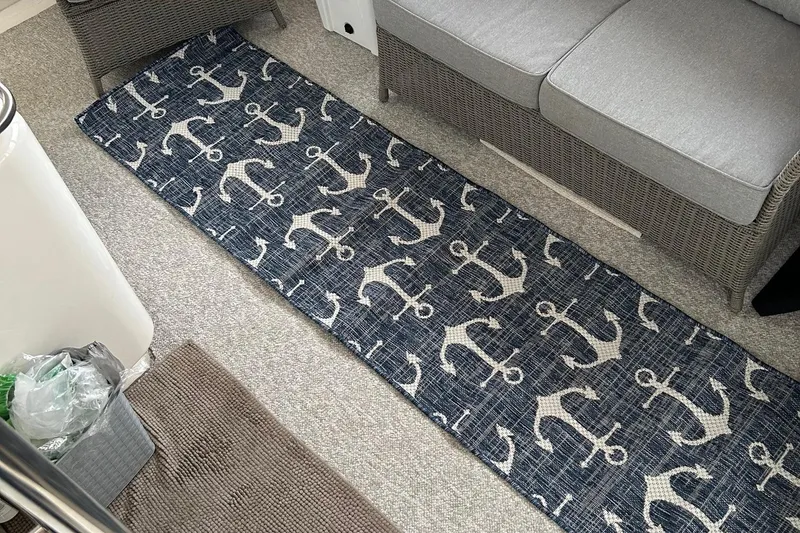 Slide: The Image of Nautical-themed rug with anchor pattern on a 2001 Sea Ray 420 Aft Cabin yacht. - 11