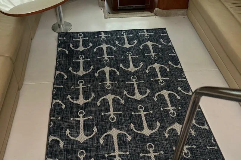 Slide: The Image of Nautical-themed rug with anchor pattern in 2001 Sea Ray 420 Aft Cabin interior. - 12