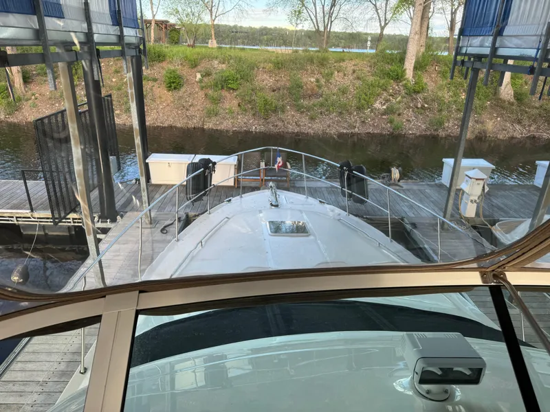 Slide: The Image of 2001 Sea Ray 420 Aft Cabin yacht docked at marina, viewed from helm. - 26