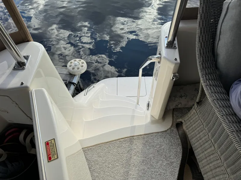 Slide: The Image of 2001 Sea Ray 420 Aft Cabin boat deck with steps and water view. - 28