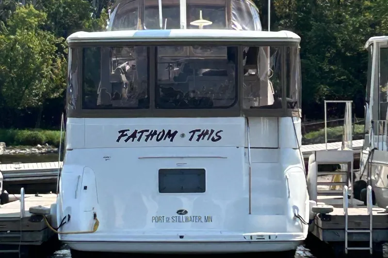 Slide: The Image of 2001 Sea Ray 420 Aft Cabin yacht docked, named "Fathom This," at Stillwater, MN. - 3
