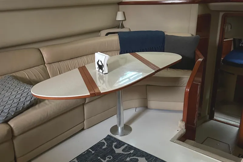 Slide: The Image of Interior of 2001 Sea Ray 420 Aft Cabin with elegant seating and table. - 39