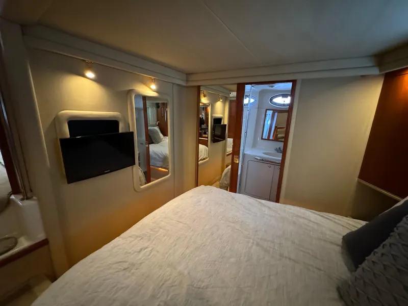 Slide: The Image of Interior of 2001 Sea Ray 420 Aft Cabin with cozy bedroom and modern amenities. - 43