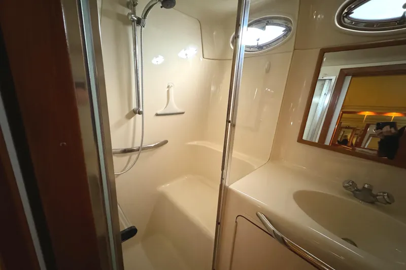 Slide: The Image of Bathroom interior of 2001 Sea Ray 420 Aft Cabin yacht, featuring shower and sink. - 46