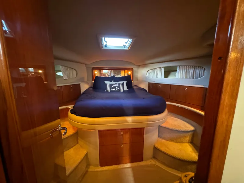 Slide: The Image of Luxurious cabin interior of 2001 Sea Ray 420 Aft Cabin yacht with cozy bed. - 52