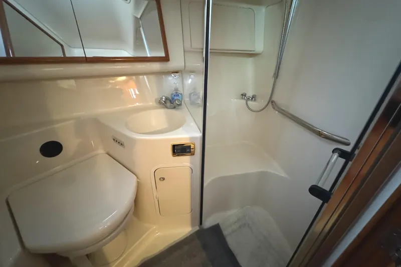 Slide: The Image of 2001 Sea Ray 420 Aft Cabin bathroom with shower, sink, and toilet. - 61