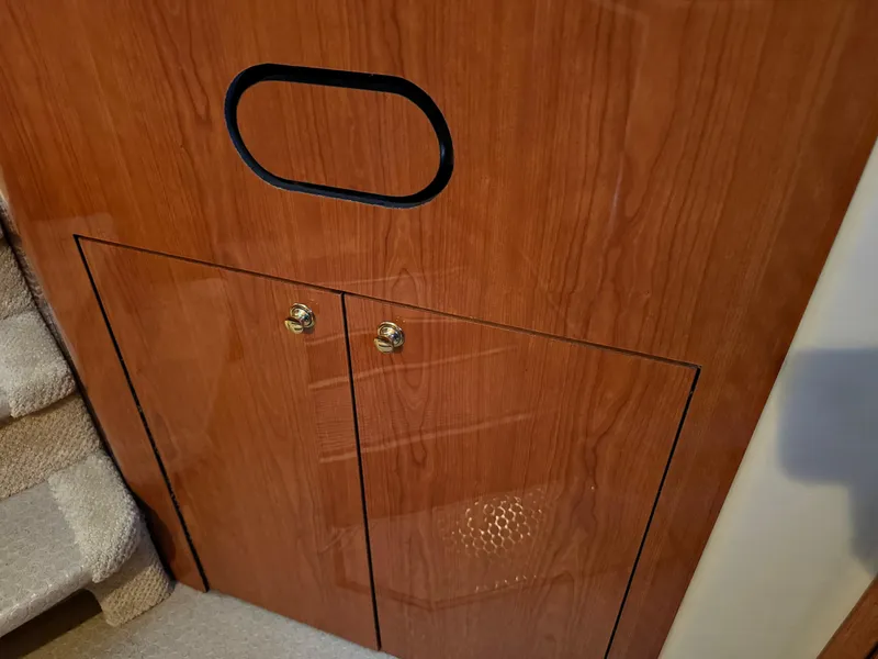 Slide: The Image of Wooden cabinet with brass handles on a 2001 Sea Ray 420 Aft Cabin yacht. - 62