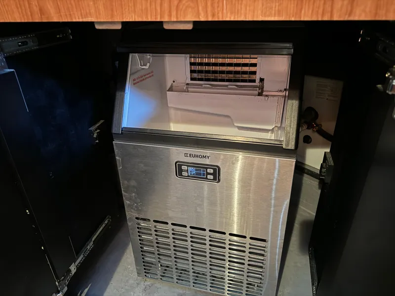 Slide: The Image of Ice maker inside 2001 Sea Ray 420 Aft Cabin yacht, featuring a stainless steel design. - 63