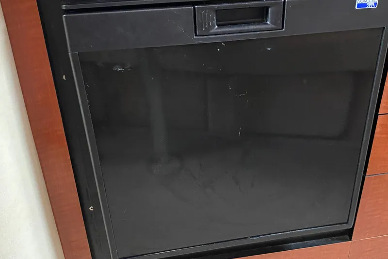 Slide: The Image of Black appliance door on 2005 Sea Ray 300 Sundancer yacht interior. - 17