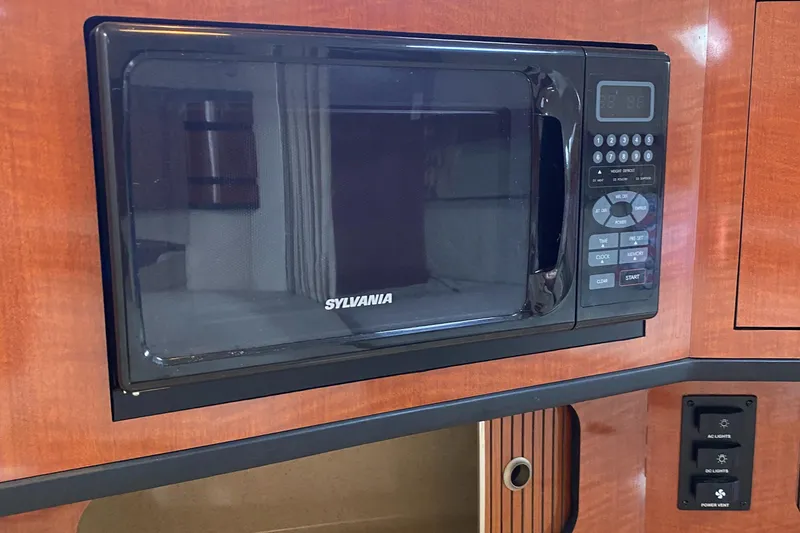 Slide: The Image of Sylvania microwave in 2005 Sea Ray 300 Sundancer boat kitchen. - 18