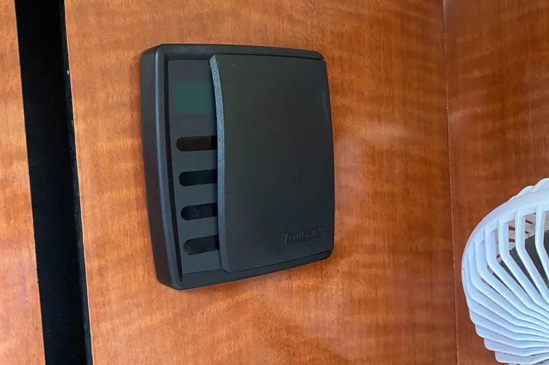 Slide: The Image of Thermostat on 2005 Sea Ray 300 Sundancer boat interior wooden panel. - 19