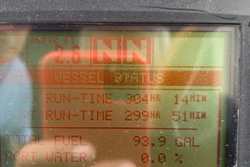 Slide: The Image of Display screen of 2005 Sea Ray 300 Sundancer showing vessel data and fuel levels. - 25
