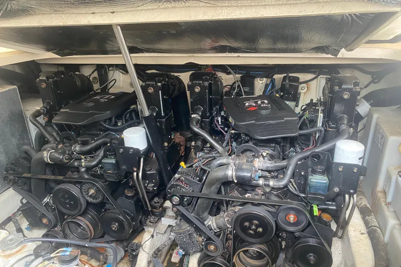 Slide: The Image of Engine compartment of a 2005 Sea Ray 300 Sundancer boat, showcasing dual engines. - 32