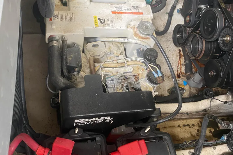 Slide: The Image of Engine compartment of a 2005 Sea Ray 300 Sundancer with Kohler generator. - 33
