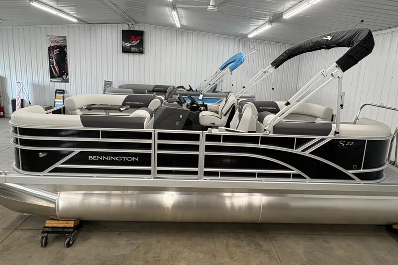 Slide: The Image of 2026 Bennington 22 SSR Stern Radius SNAP pontoon boat in showroom. - 0
