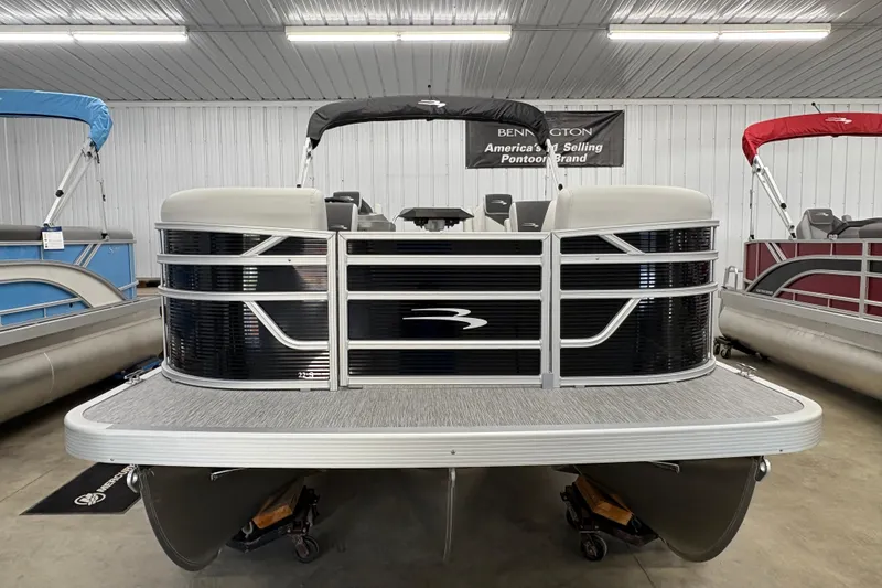 Slide: The Image of 2026 Bennington 22 SSR Stern Radius SNAP pontoon boat in showroom display. - 1