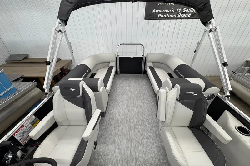 Slide: The Image of 2026 Bennington 22 SSR Stern Radius SNAP pontoon boat interior with plush seating and canopy. - 11